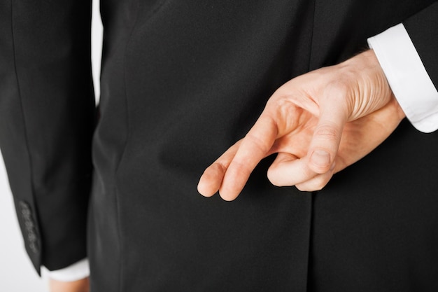 bright picture of man with crossed fingers