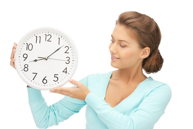 bright picture of woman holding big clock