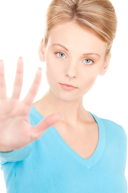 bright picture of young woman making stop gesture