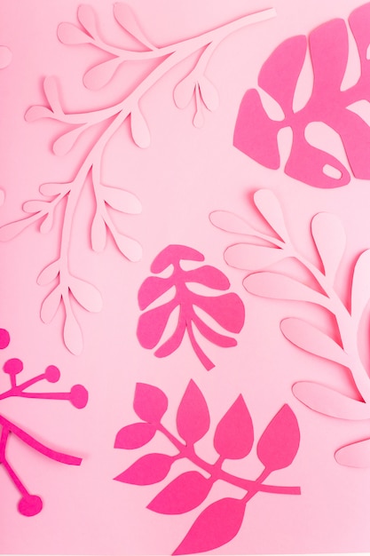 Bright pink leaves of paper on light pink