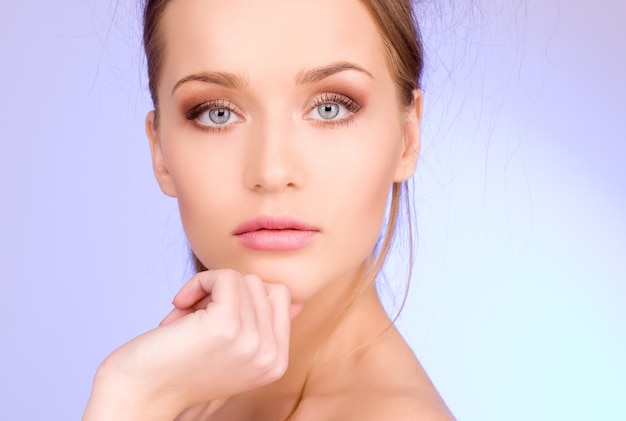 bright Portrait of lovely woman over blue