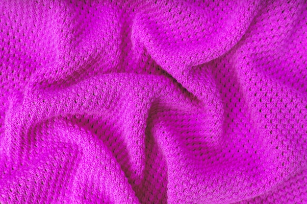 Bright purple knitwear wool fabric texture background Abstract textile backdrop