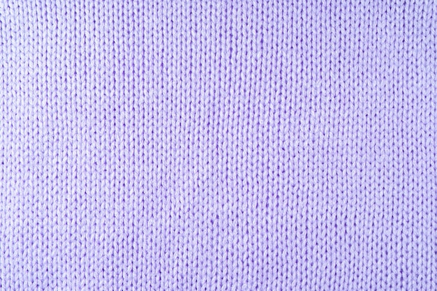 Bright purple knitwear wool fabric texture background Abstract textile backdrop