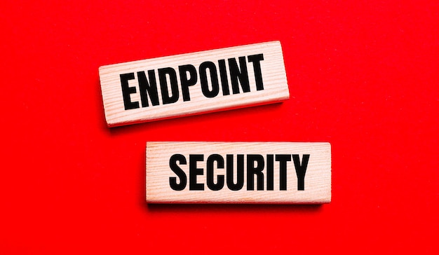 On a bright red background there are two light wooden blocks with the text ENDPOINT SECURITY