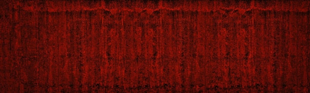 Bright red dark gloomy sinister widescreen abstract background Old concrete wall wide texture