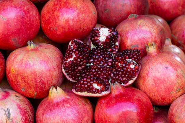 Bright red juicy pomegranate with peeled skin