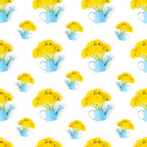 Bright seamless pattern made with bouquet of yellow flowers in blue watering can on white background as a backdrop or texture Spring summer floral wallpaper for your design Top view Flat lay