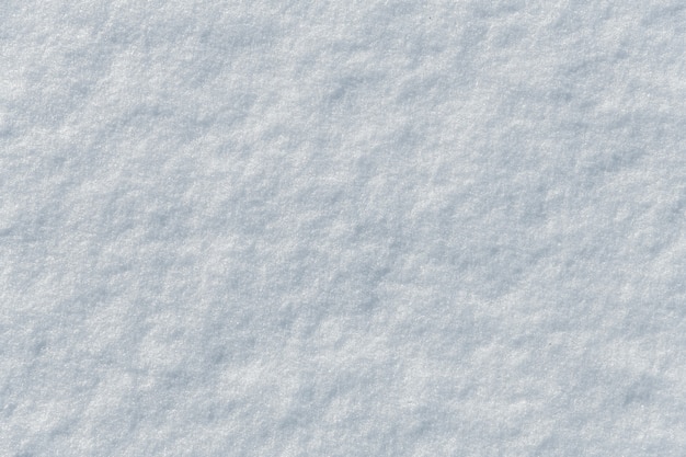 Bright snow surface as background texture. Top view.