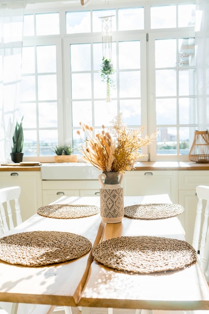 Bright spacious dining room with wooden big table