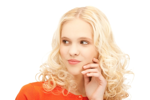 bright studio picture of beautiful pensive teenage girl