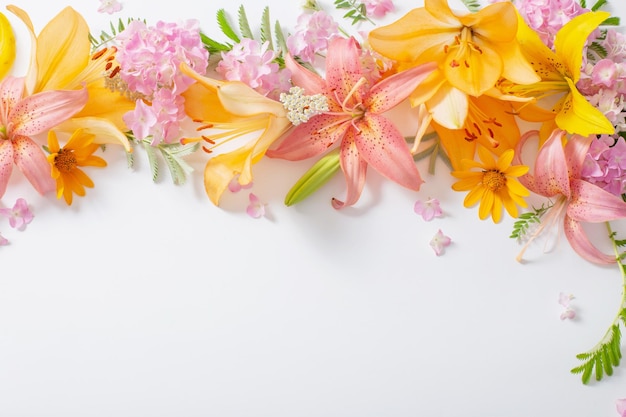 Bright summer flowers on white background