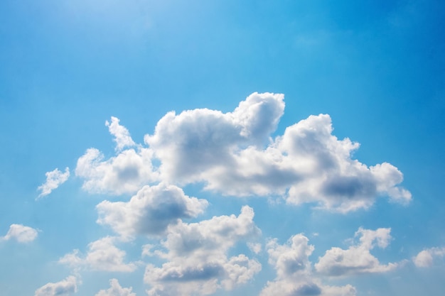 Bright sunlight illuminated white clouds in the blue sky