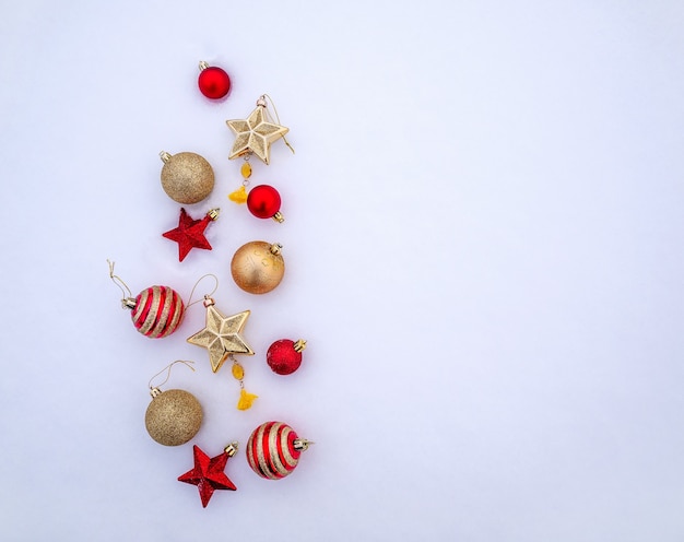 Bright trinkets Christmas balls snowflakes and stars in the snow christmas decorations