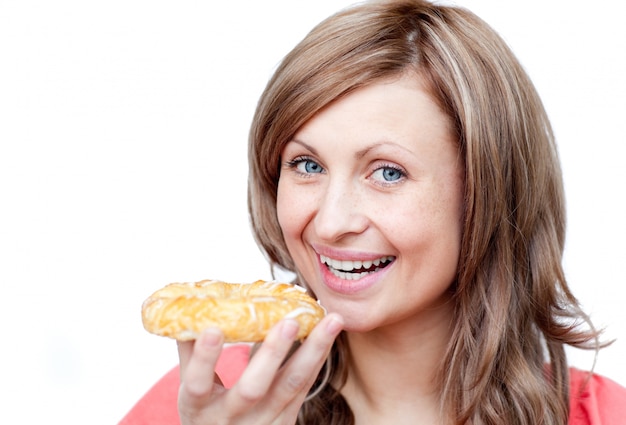 Bright woman eating a cake