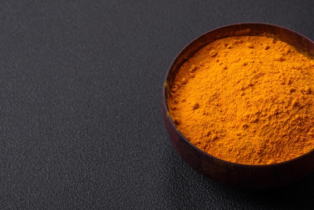 Bright yellow turmeric or curry spice for Asian food preparation