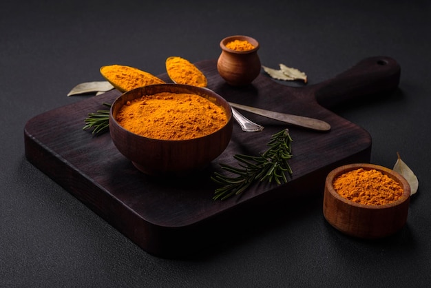 Bright yellow turmeric or curry spice for Asian food preparation