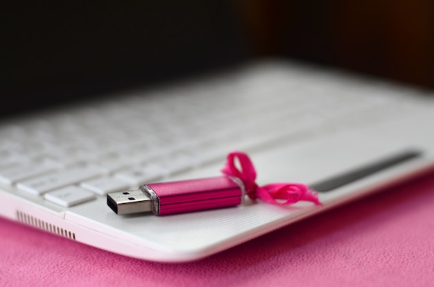 Brilliant pink usb flash memory card with a pink bow