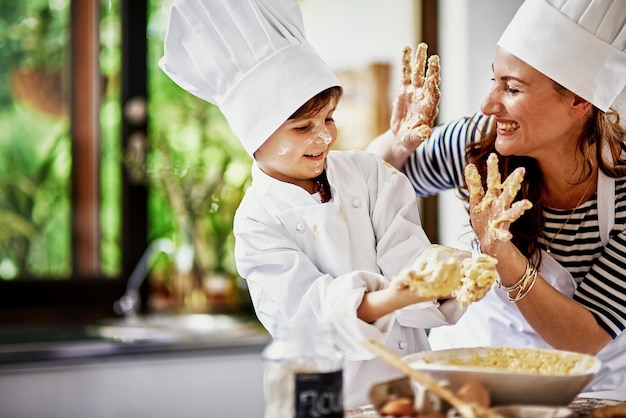 Bring it in for team work Shot of a mother and her son baking in the kitchen