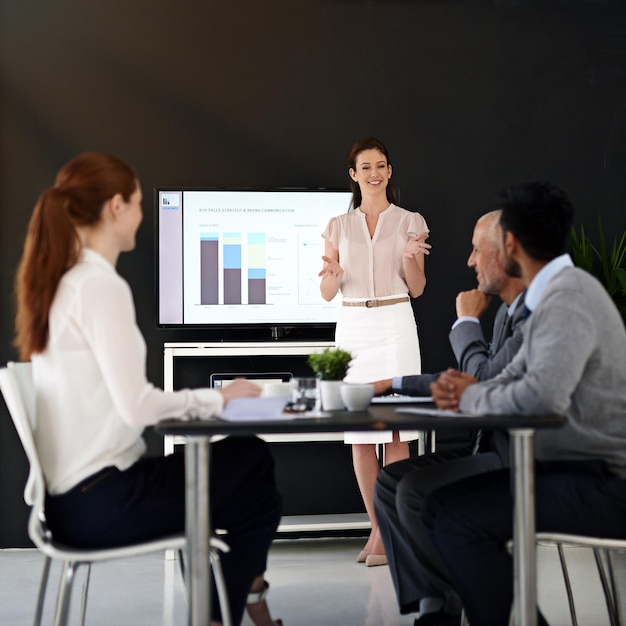 Bringing her perspective and expertise to the front Cropped shot of a young businesswoman delivering a presentation in a boardroom