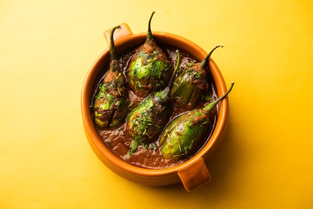 Brinjal curry also known as spicy baingan or eggplant masala, a popular main course recipe from India served in a bowl, karahi or pan