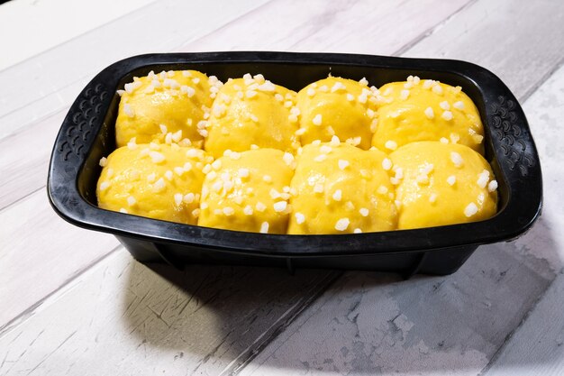 Brioche dough with butter and sugar in a silicone mold before going into the oven