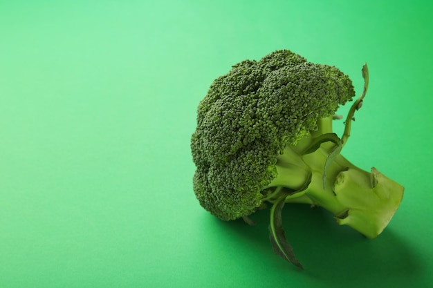 Broccoli cabbage on a green background. Pattern of fresh broccoli cabbage. Top view.