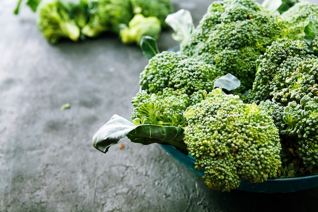 Broccoli cabbage in a plate on a dark surface