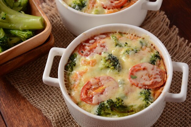 Broccoli, cheese and  egg casserole in baking cocottes