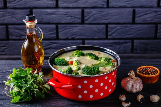 Broccoli cheese soup in a pot top view