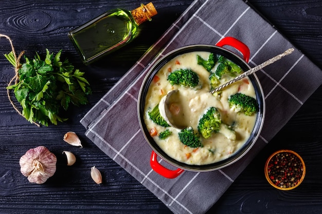 Broccoli cheese soup in a pot top view