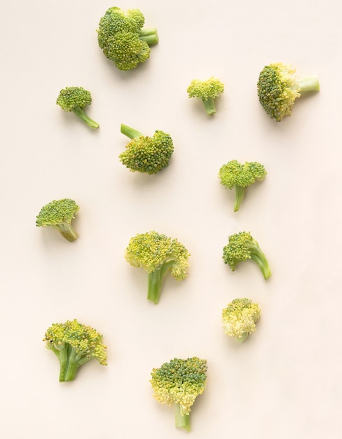 Broccoli on a light pink surface. view from above