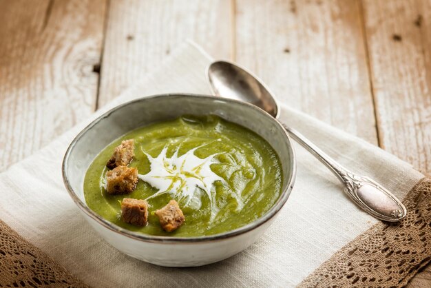 Broccoli soup with crusty bread and cream sauce