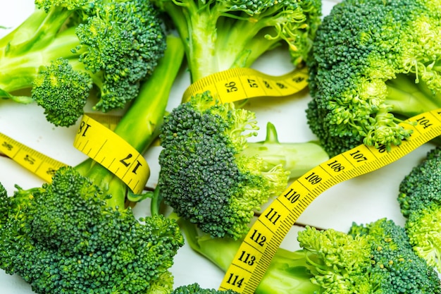 Broccoli stems with the yellow measuring tape close up shot