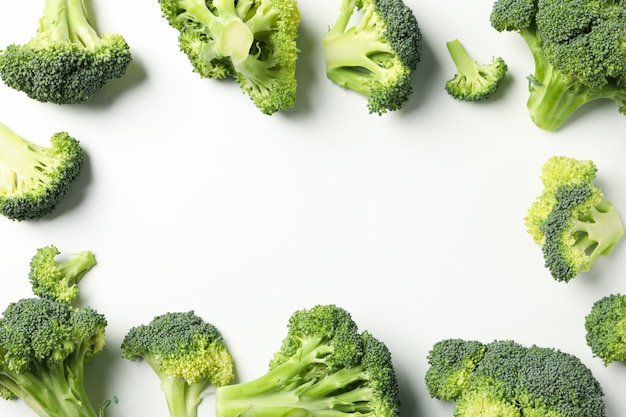 Broccoli on white, top view and space for text