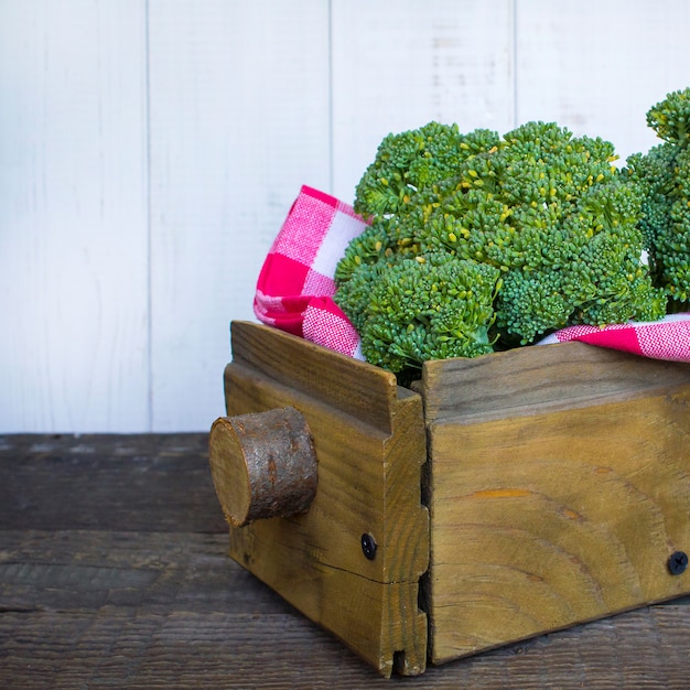 Broccoli in a wooden box background