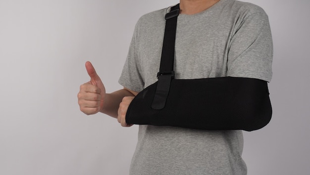 Broken arm Arm Sling therapy support and covered around elbow first knuckle broken arm