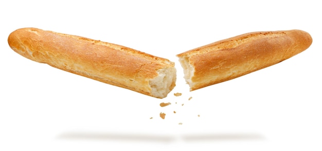 Broken baguette falls on a white background cut Isolated