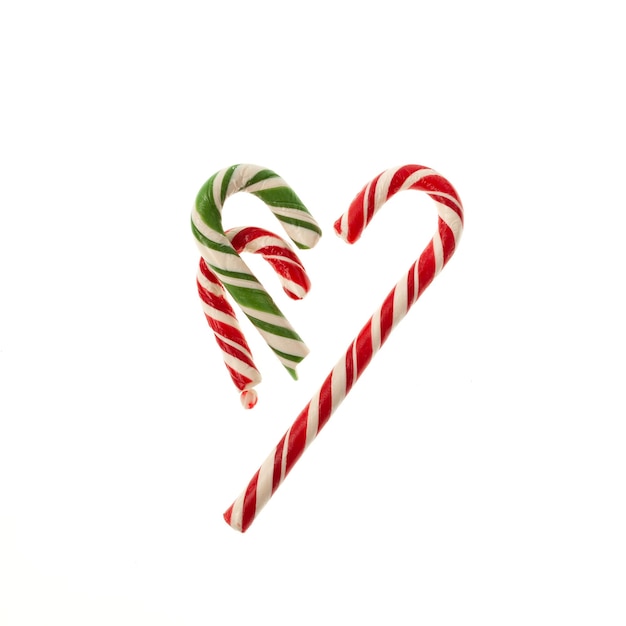 Broken Christmas Candy canes on white background Traditional Christmas sweets New year concept