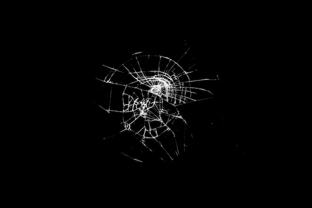 Broken glass is insulated against a black background. white cracks. High quality photo