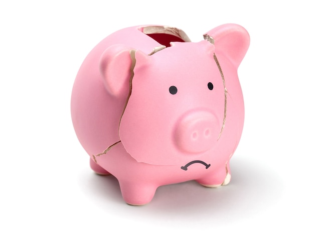 Broken piggy bank isolated on white background.