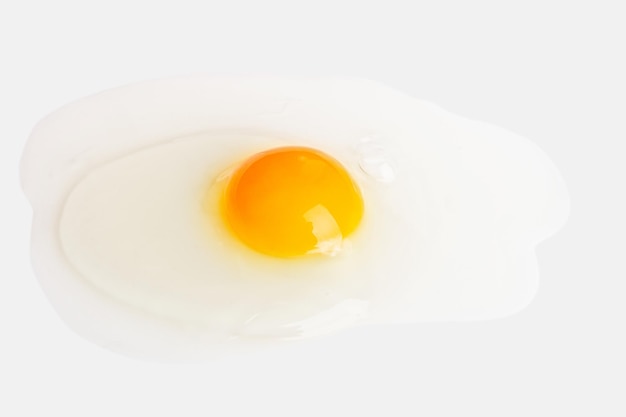 Broken spilled egg on a light background