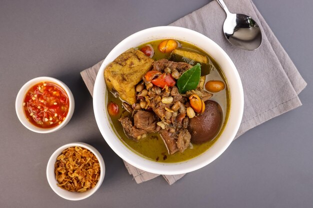 Brongkos is a Yogyakarta Spicy Meat and Bean Stew with a Special Spice Kluwek in Coconut Milk Soup