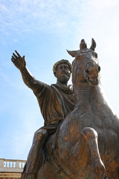 Bronze Roman equestrian statue of Emperor Marcus Aurelius against the blue sky Rome Italy