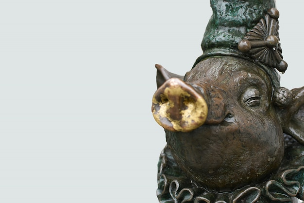 A bronze sculpture of a pig, copy Space