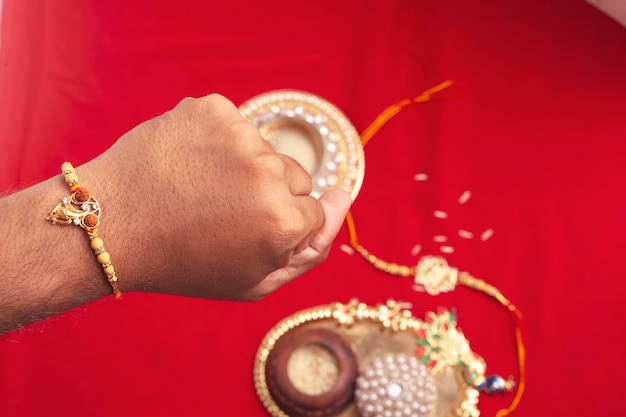 Brother showing rakhi on his hand on an occasion of Raksha Bandh