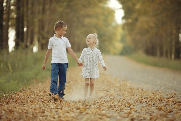 Brother and sister Autumn road