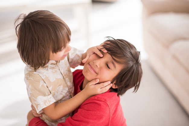 Brothers at home playing together