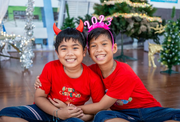 Brothers hugging each other at Christmas To show love within the family Christmas Festival