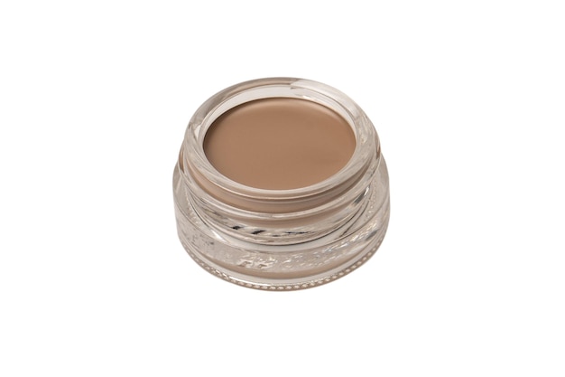 A brow pomade in blonde shade with brush isolated on a white background