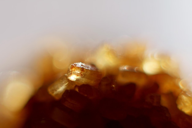 Brown cane sugar crystals closeup